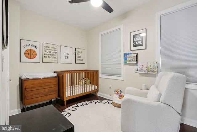 929 S 18th St, Philadelphia, PA 19146 - bedroom with a nursery area, dark wood-style floors, and a ceiling fan