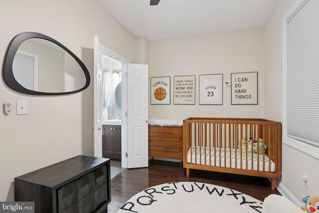 929 S 18th St, Philadelphia, PA 19146 - bedroom featuring dark wood-style flooring, a nursery area, and a ceiling fan
