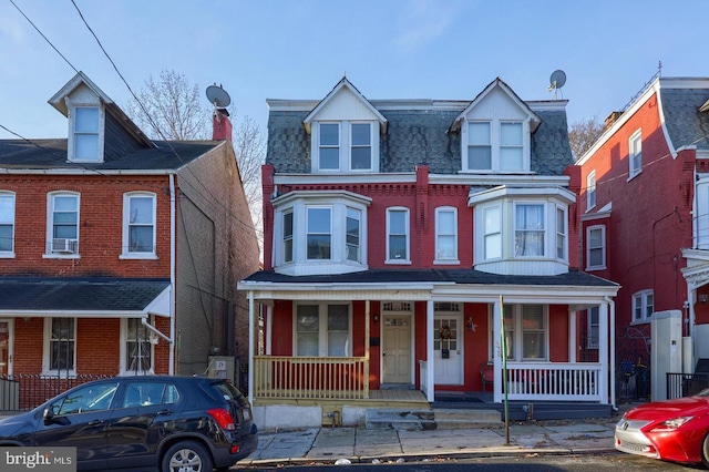 538 S Lime St, Lancaster, PA 17602 - view of property with a porch and mansard roof
