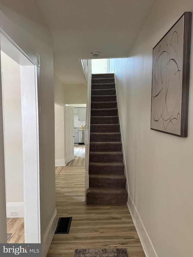 538 S Lime St, Lancaster, PA 17602 - staircase with wood finished floors and baseboards