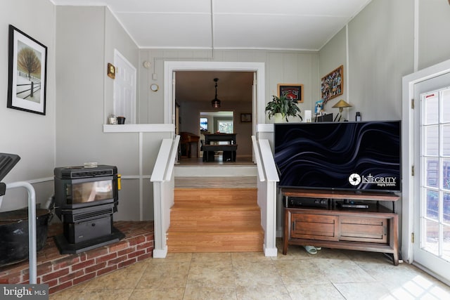 251 Kelly Dr, Harpers Ferry, WV 25425 - kitchen with ornamental molding, healthy amount of natural light, a wood stove, and tile patterned flooring