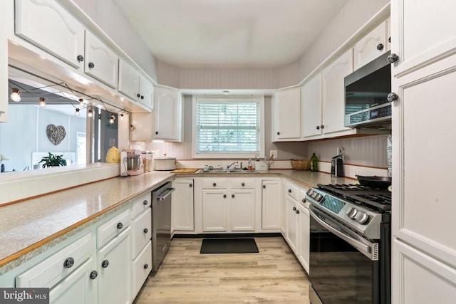 251 Kelly Dr, Harpers Ferry, WV 25425 - kitchen featuring stainless steel appliances, white cabinets, light wood-type flooring, and light countertops