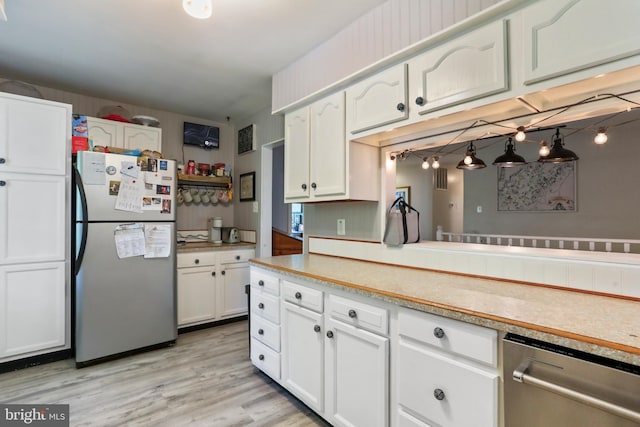 251 Kelly Dr, Harpers Ferry, WV 25425 - kitchen featuring freestanding refrigerator, dishwasher, white cabinetry, and light countertops