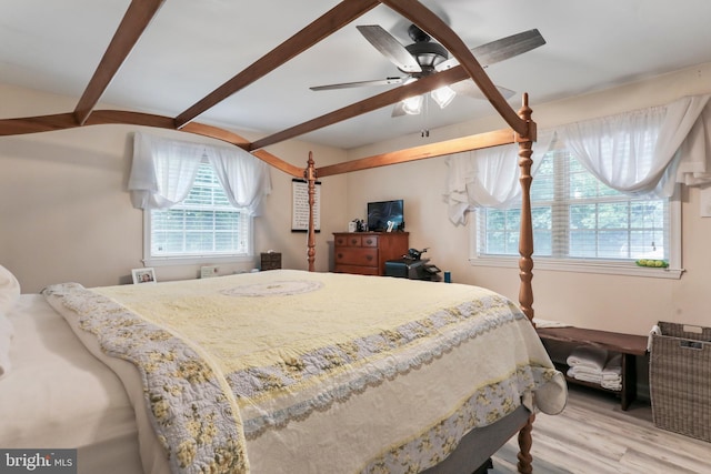 251 Kelly Dr, Harpers Ferry, WV 25425 - bedroom featuring multiple windows, wood finished floors, beamed ceiling, and ceiling fan