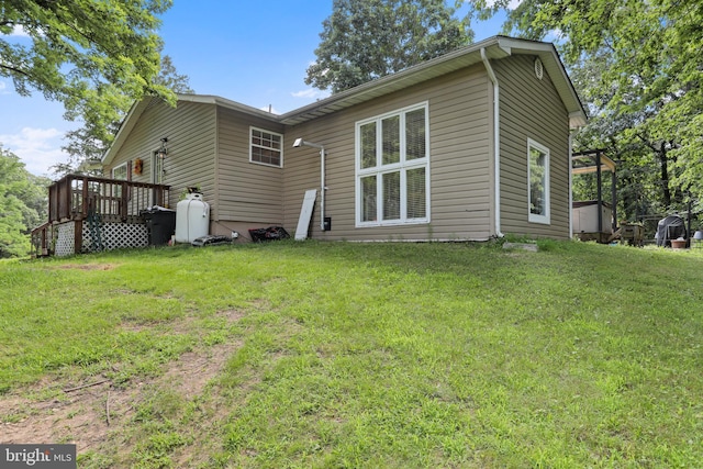 251 Kelly Dr, Harpers Ferry, WV 25425 - rear view of property featuring a wooden deck and a lawn