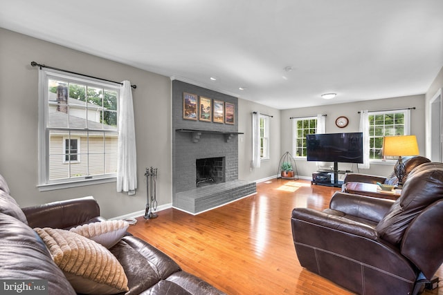15321 Peach Orchard Rd, Silver Spring, MD 20905 - living room with plenty of natural light, a fireplace, and wood finished floors