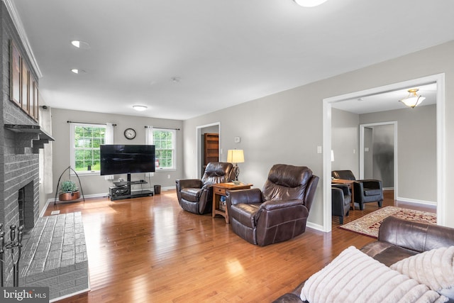 15321 Peach Orchard Rd, Silver Spring, MD 20905 - living area with a brick fireplace and wood finished floors