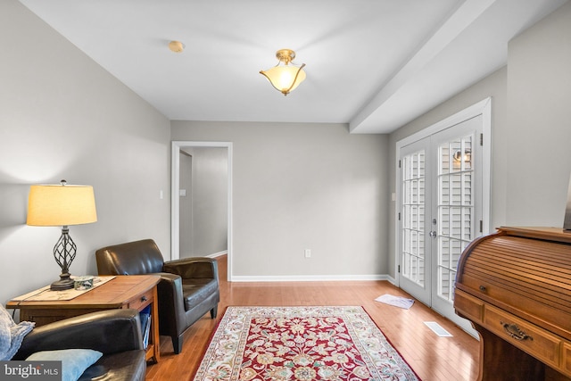 15321 Peach Orchard Rd, Silver Spring, MD 20905 - living area with light wood-style flooring and french doors
