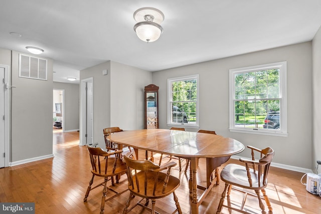 15321 Peach Orchard Rd, Silver Spring, MD 20905 - dining room with light wood-type flooring and baseboards