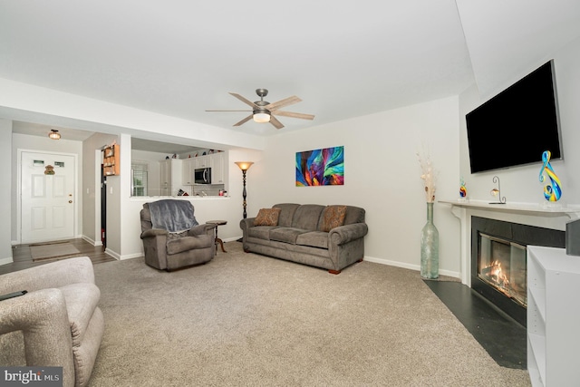1866 Wexford Rd, Palmyra, PA 17078 - carpeted living room featuring a fireplace with flush hearth and ceiling fan