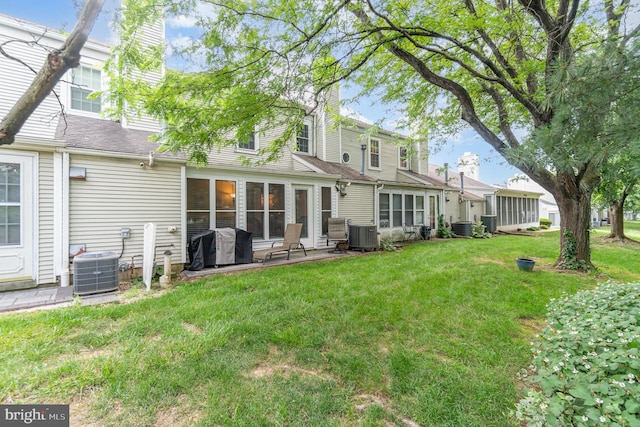 1866 Wexford Rd, Palmyra, PA 17078 - back of house with a chimney and a lawn