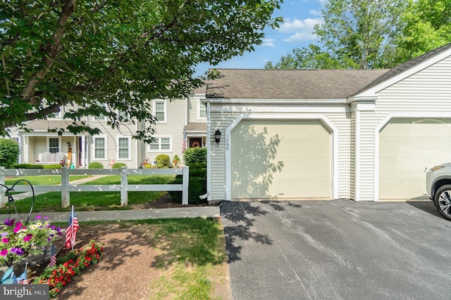 1866 Wexford Rd, Palmyra, PA 17078 - view of property featuring asphalt driveway, an attached garage, and roof with shingles
