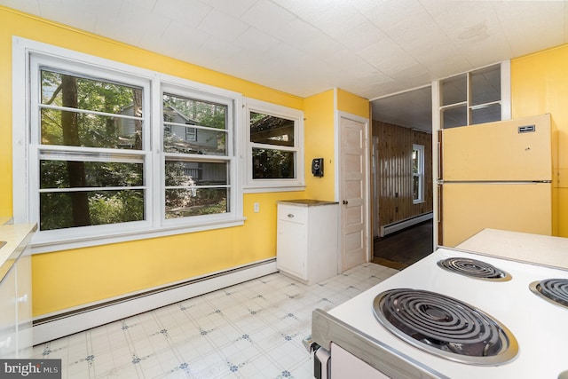 505 7th St, Mount Gretna, PA 17064 - kitchen featuring freestanding refrigerator, range, baseboard heating, and light flooring