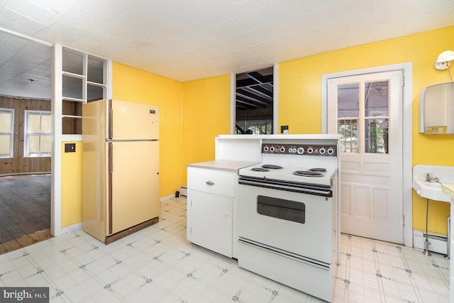 505 7th St, Mount Gretna, PA 17064 - kitchen with white appliances, healthy amount of natural light, white cabinets, and light floors
