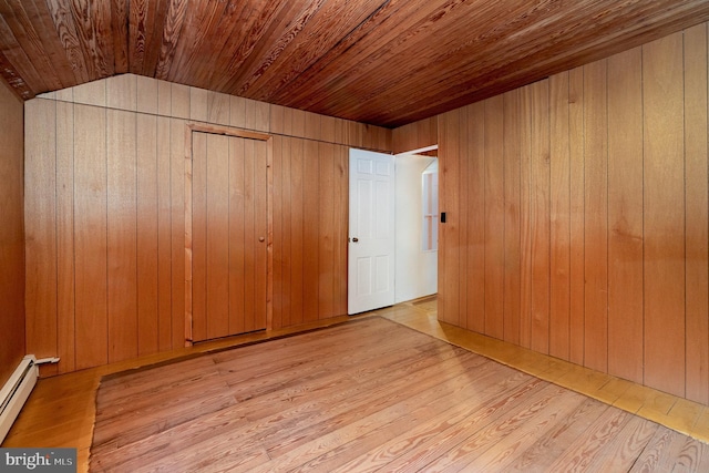 505 7th St, Mount Gretna, PA 17064 - unfurnished bedroom featuring wooden ceiling, a baseboard radiator, wood finished floors, and wood walls