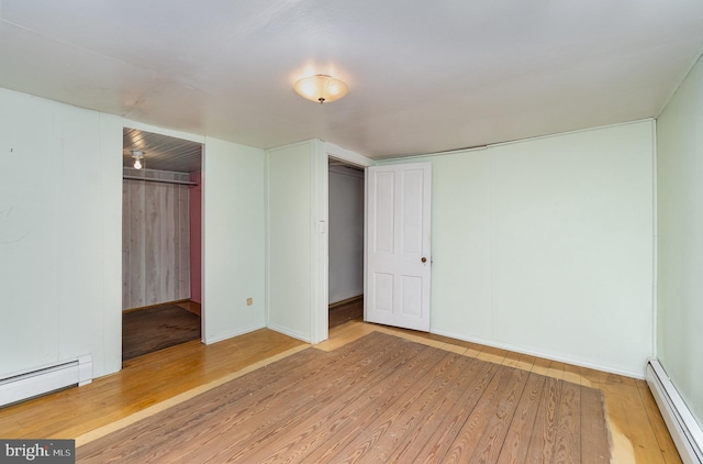505 7th St, Mount Gretna, PA 17064 - unfurnished bedroom featuring a baseboard radiator, wood finished floors, and a closet