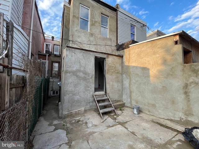 706 W Butler St, Philadelphia, PA 19140 - back of house with entry steps and stucco siding