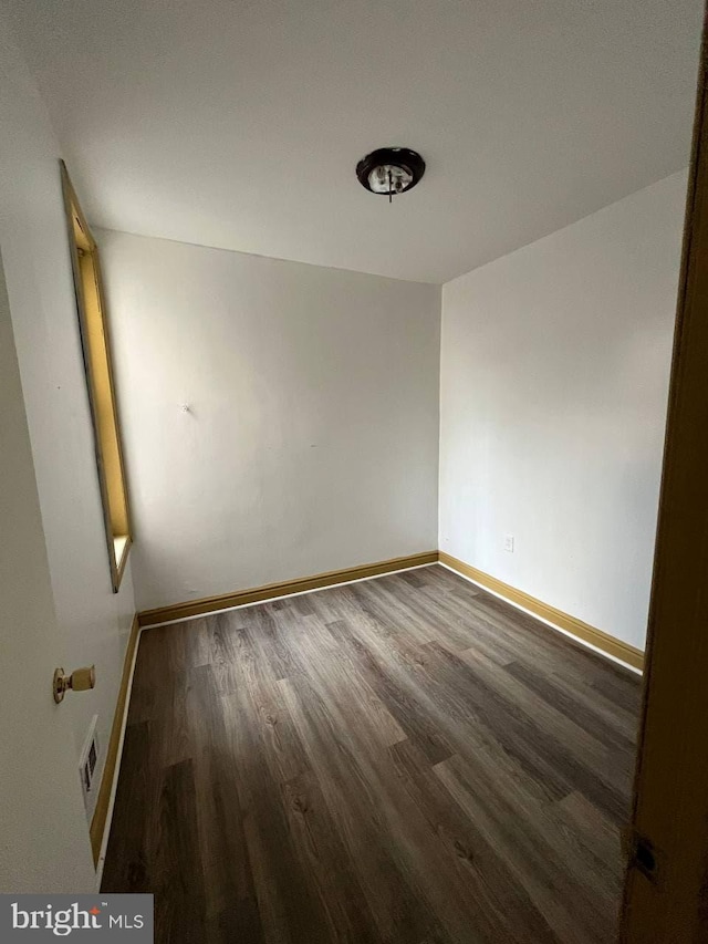 706 W Butler St, Philadelphia, PA 19140 - spare room featuring wood finished floors and baseboards