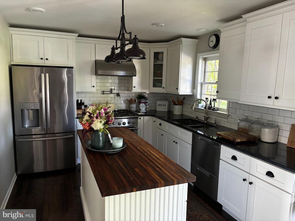 15 Limestone Ct, Lititz, PA 17543 - kitchen featuring stainless steel appliances, butcher block counters, wall chimney range hood, a center island, and white cabinets