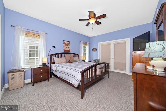231 Lupine Dr, Smyrna, DE 19977 - bedroom featuring french doors, light colored carpet, and a ceiling fan