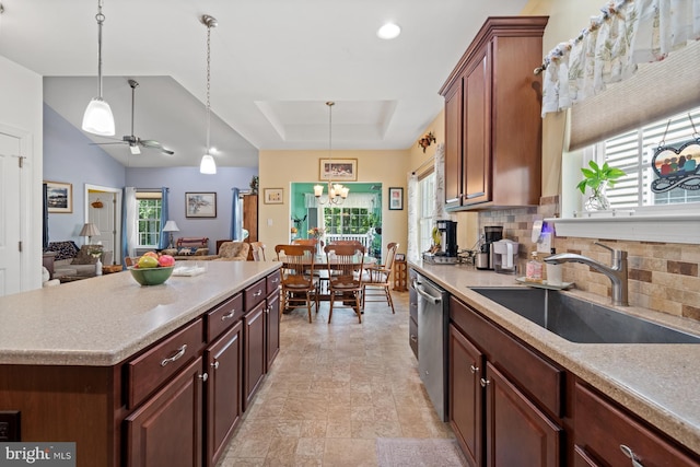 231 Lupine Dr, Smyrna, DE 19977 - kitchen featuring backsplash, dishwasher, decorative light fixtures, open floor plan, and light countertops