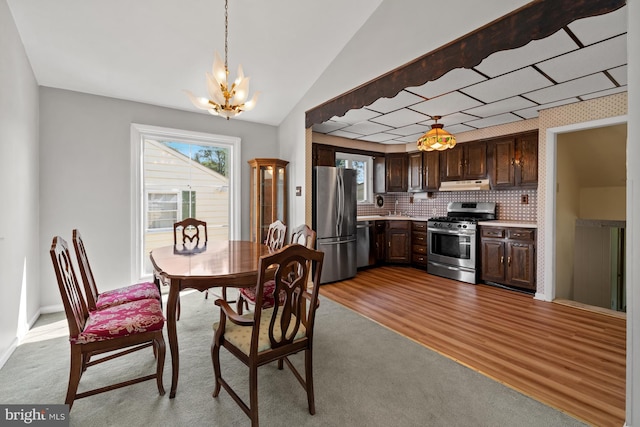 411 Parkstone Way, Broomall, PA 19008 - carpeted dining room featuring a chandelier, plenty of natural light, and vaulted ceiling