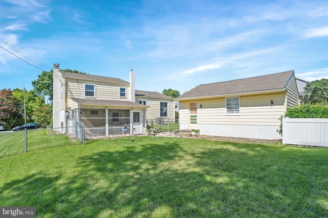 411 Parkstone Way, Broomall, PA 19008 - rear view of house with a sunroom, a chimney, and a fenced backyard