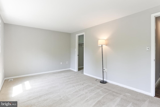 7547 Filbert Ter, Gaithersburg, MD 20879 - unfurnished bedroom featuring carpet flooring, a walk in closet, and a closet
