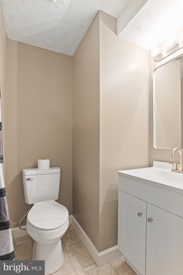 7547 Filbert Ter, Gaithersburg, MD 20879 - bathroom featuring a textured ceiling and vanity