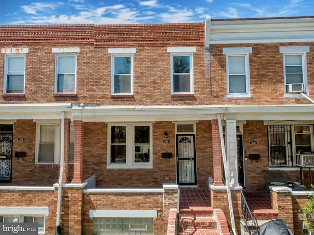 3335 Dudley Ave, Baltimore, MD 21213 - multi unit property featuring brick siding, cooling unit, and a porch