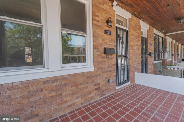 3335 Dudley Ave, Baltimore, MD 21213 - entrance to property featuring covered porch and brick siding