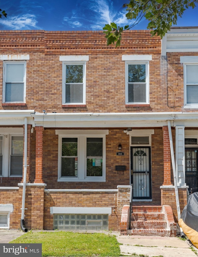 3335 Dudley Ave, Baltimore, MD 21213 - multi unit property with a porch and brick siding
