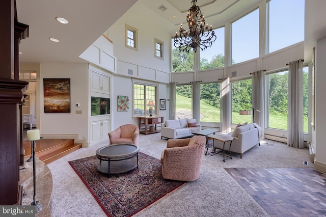 5751 Mount Pisgah Rd, York, PA 17406 - living area with a chandelier, carpet flooring, a towering ceiling, and recessed lighting