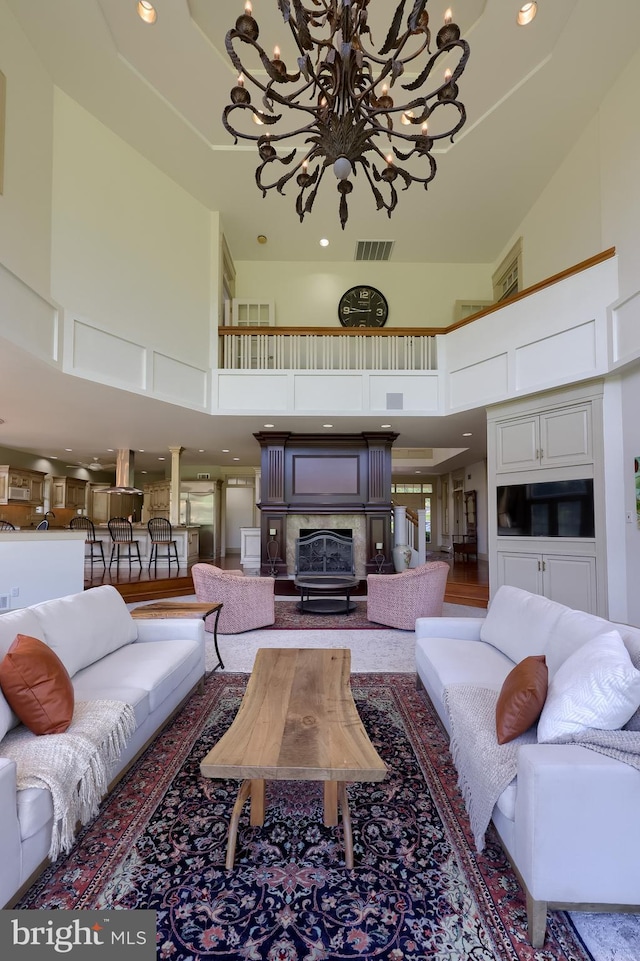 5751 Mount Pisgah Rd, York, PA 17406 - living area with a chandelier, a towering ceiling, and recessed lighting