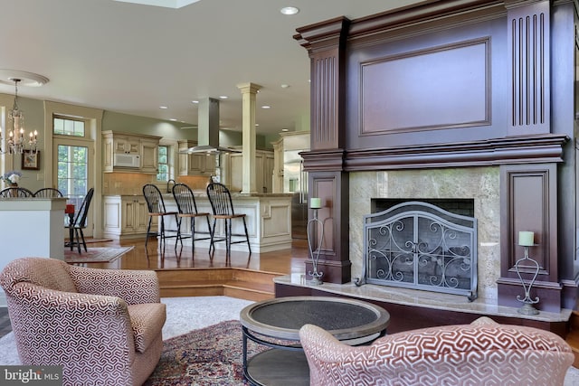 5751 Mount Pisgah Rd, York, PA 17406 - living area featuring light wood finished floors, a premium fireplace, a chandelier, and recessed lighting