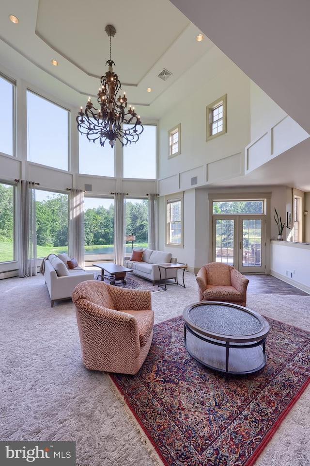 5751 Mount Pisgah Rd, York, PA 17406 - carpeted living room featuring a high ceiling, a chandelier, and recessed lighting
