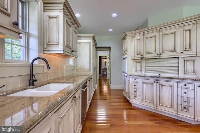 5751 Mount Pisgah Rd, York, PA 17406 - kitchen with backsplash, light wood-style flooring, recessed lighting, light stone countertops, and cream cabinetry