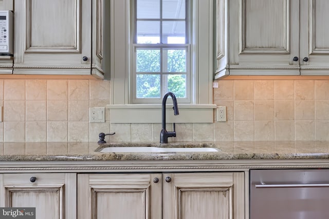 5751 Mount Pisgah Rd, York, PA 17406 - kitchen featuring stainless steel dishwasher, backsplash, and light stone countertops