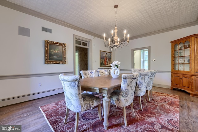5751 Mount Pisgah Rd, York, PA 17406 - dining area featuring a chandelier, wood finished floors, a baseboard heating unit, and crown molding