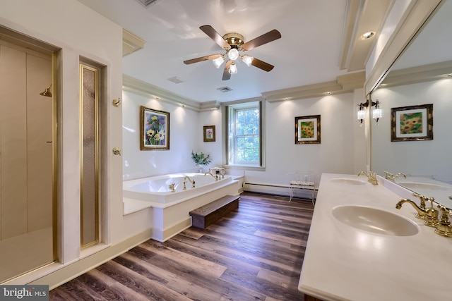 5751 Mount Pisgah Rd, York, PA 17406 - bathroom featuring a ceiling fan, a bath, wood finished floors, double vanity, and a baseboard radiator
