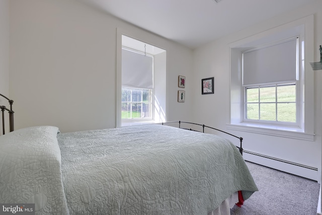 5751 Mount Pisgah Rd, York, PA 17406 - bedroom featuring a baseboard heating unit, multiple windows, and carpet flooring