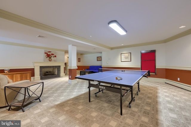 5751 Mount Pisgah Rd, York, PA 17406 - game room featuring crown molding, light colored carpet, a fireplace, a baseboard heating unit, and wainscoting