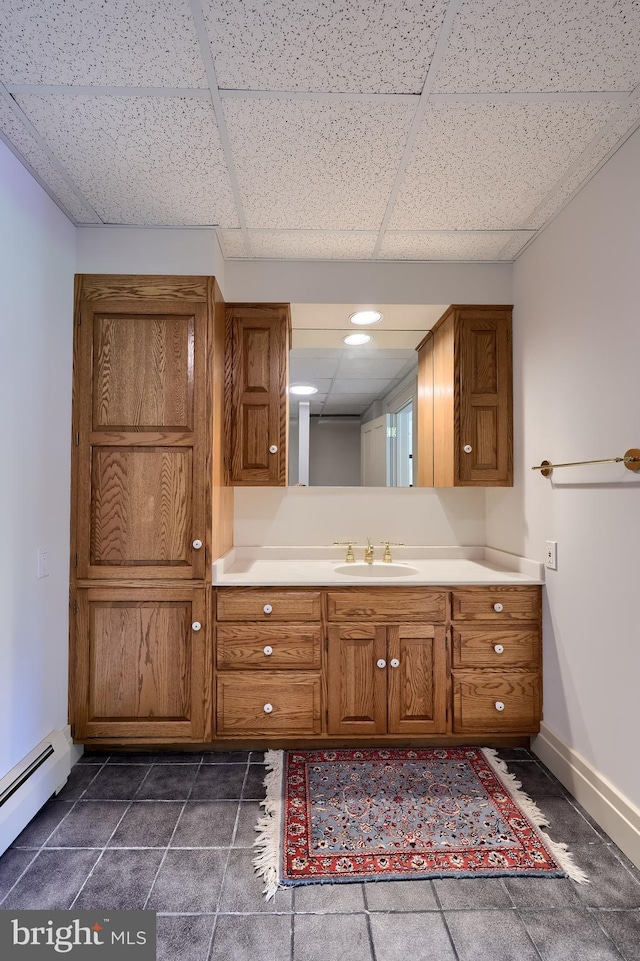 5751 Mount Pisgah Rd, York, PA 17406 - bathroom featuring a drop ceiling, a baseboard heating unit, and vanity