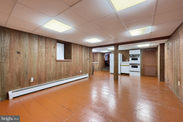 5751 Mount Pisgah Rd, York, PA 17406 - finished below grade area with a baseboard radiator, wood walls, hardwood / wood-style flooring, a drop ceiling, and freestanding refrigerator