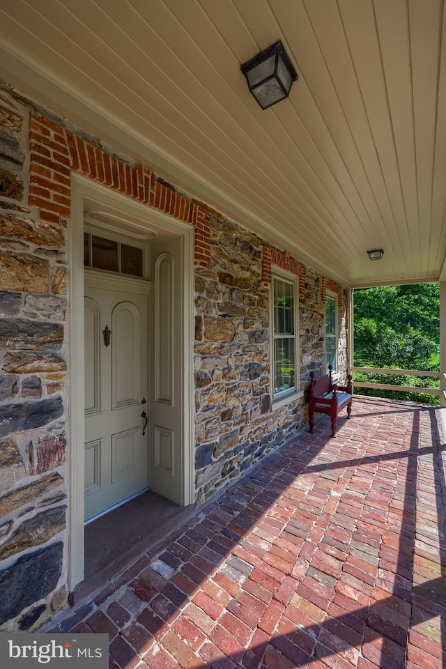 5751 Mount Pisgah Rd, York, PA 17406 - property entrance with a porch and stone siding