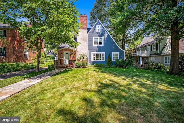 206 E Lake Ave, Baltimore, MD 21212 - view of front of home with a front yard and a chimney
