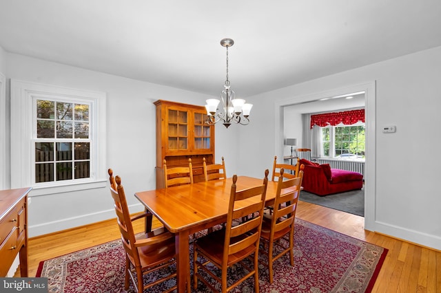 206 E Lake Ave, Baltimore, MD 21212 - dining area featuring a chandelier and light wood-style floors