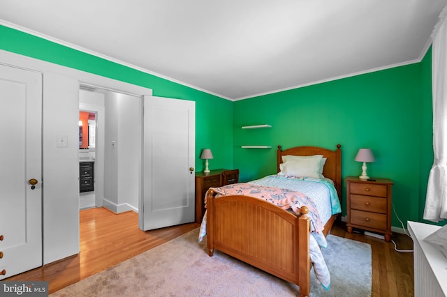 206 E Lake Ave, Baltimore, MD 21212 - bedroom with wood finished floors and ornamental molding