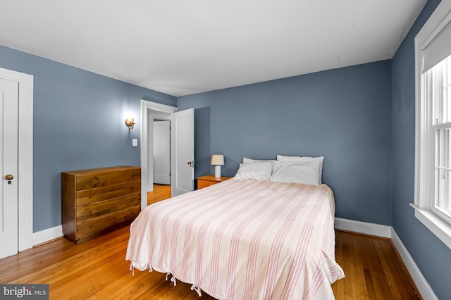 206 E Lake Ave, Baltimore, MD 21212 - bedroom with wood finished floors and multiple windows