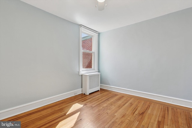 7527 Germantown Ave, Philadelphia, PA 19119 - empty room featuring radiator heating unit and wood finished floors